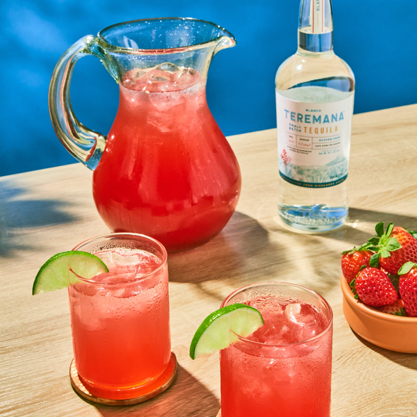 large batch strawberry margarita preparation